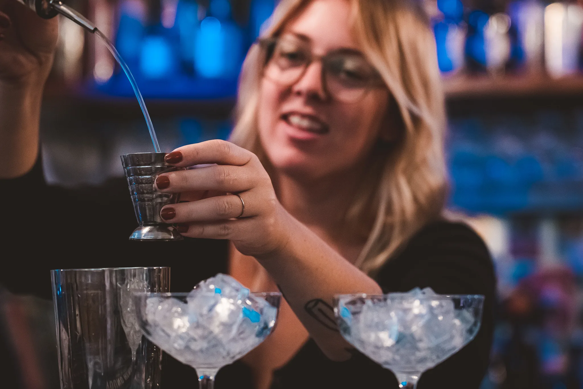 Bartender serving cocktails at a vibrant function venue in Richmond.